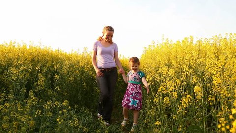 Mom and daughter in a field of flowers