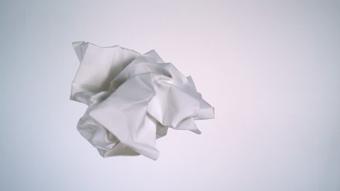Crushed paper flying in the air shooting with high speed camera, phantom flex.