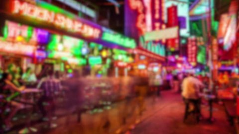 Soi Cowboy red light district in Bangkok, Thailand at night, timelapse (blurred for commercial use)