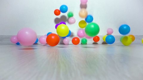Children balls slowly fall on floor