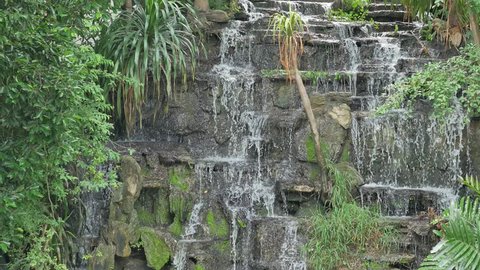 Artificial waterfall in botanic garden.