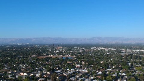 Silicon Valley late afternoon summer static aerial video of Campbell, San Jose, Los Gatos with Mount Hamilton off in the distance