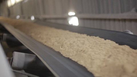 Sand is delivered by conveyor. Sand on the conveyor