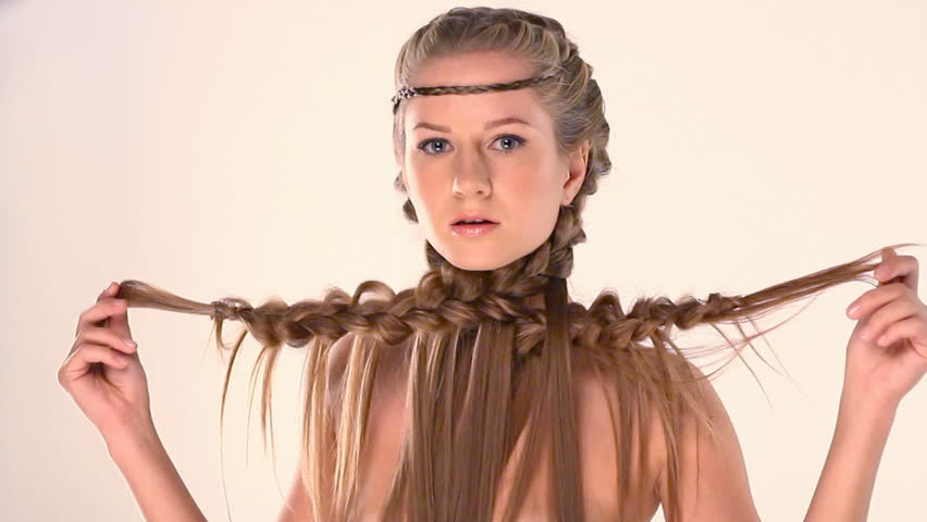beautiful young blonde with creative braid hairdo