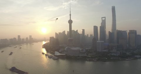 Aerial view of Lujiazui peninsula in Shanghai city with kite in the sky. Stock Video