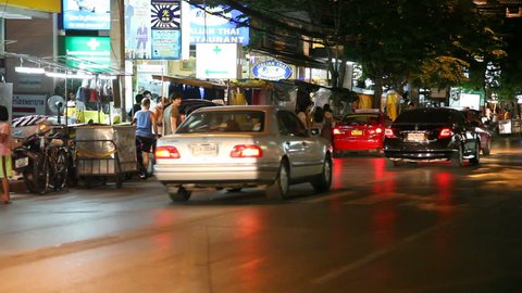 BANGKOK, THAILAND- APRIL 29: Night traffic near Patong market district on April 29, 2012 in Bangkok. Bangkok is one of the well know place for visit in Thailand.