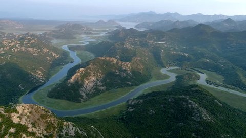 Flying over Rijeka Crnojevica River. Northern area of Skadar Lake National Park in Montenegro
