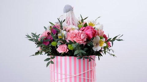 Flowers, bouquet, rotation on white background, floral composition consists of gerbera, Tulip piano, Santini , Alstroemeria, Rose odily, Orchid vanda, eucalyptus