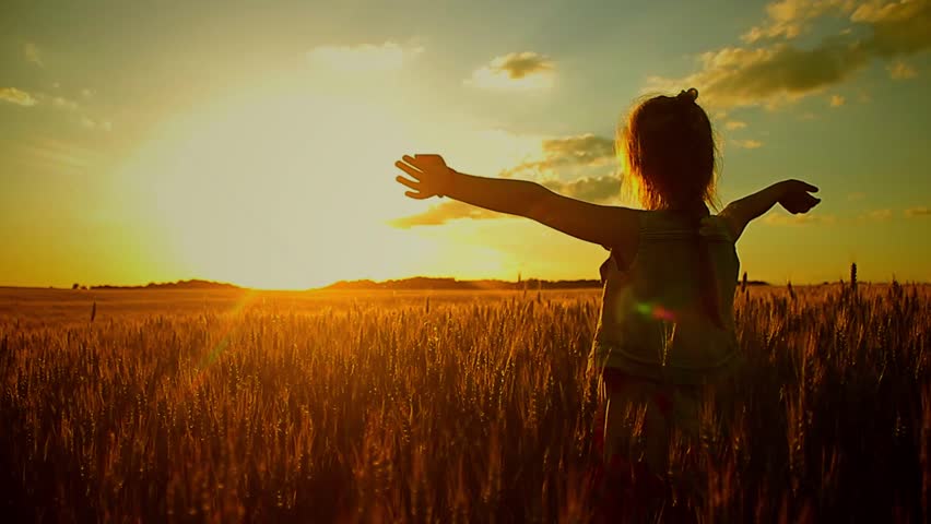 Little girl to wave hands on meadow with sunset. Happy pretty girl in field at sunset. | Shutterstock HD Video #28289065