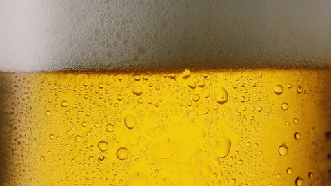 Cool fresh beer with condensation drops, 4k