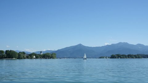 Moving across the Chiemsee shore of Fraueninsel in Bavaria, Germany in summertime