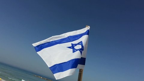 Israel Flag close up slow motion with Tel Aviv Beach in the background