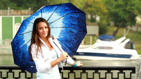 Beautiful girl posing with umbrella.
