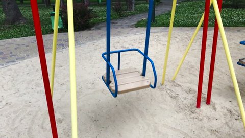 an empty swing moves