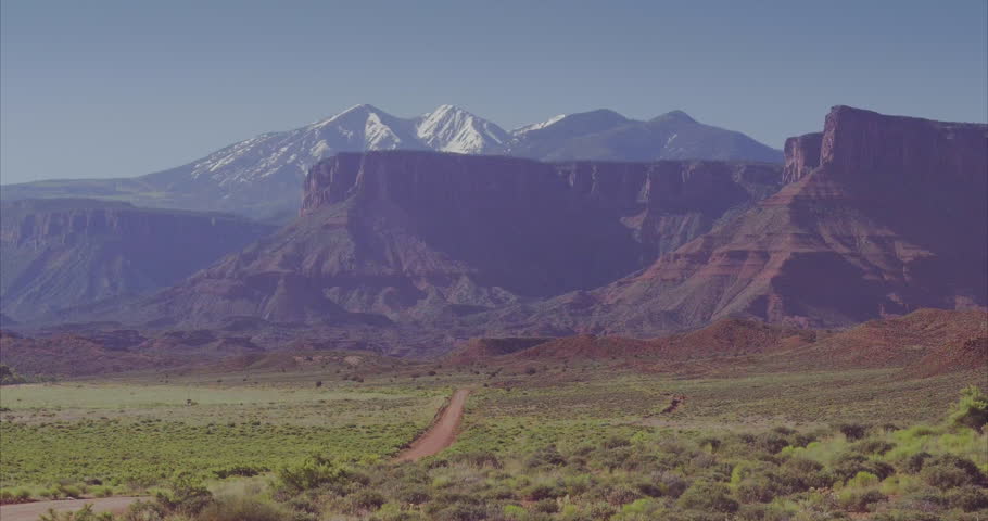 aerial of lonely dirt road in Castle Valley in Utah
