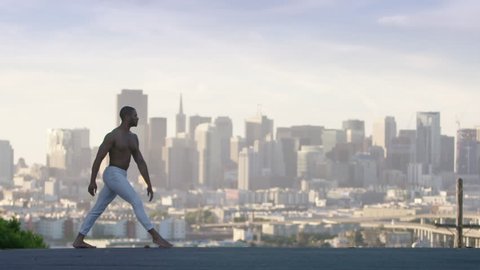 graceful ballet dancer jumping and twirling in the air in san francisco