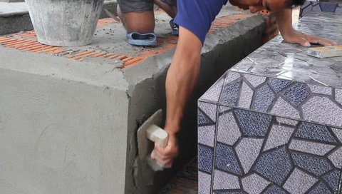 Installing Tile to a grave wall