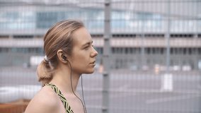 Jogging woman listens to the music on the way