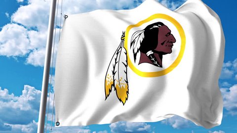 Waving flag with Washington Redskins professional team logo. 4K editorial clip