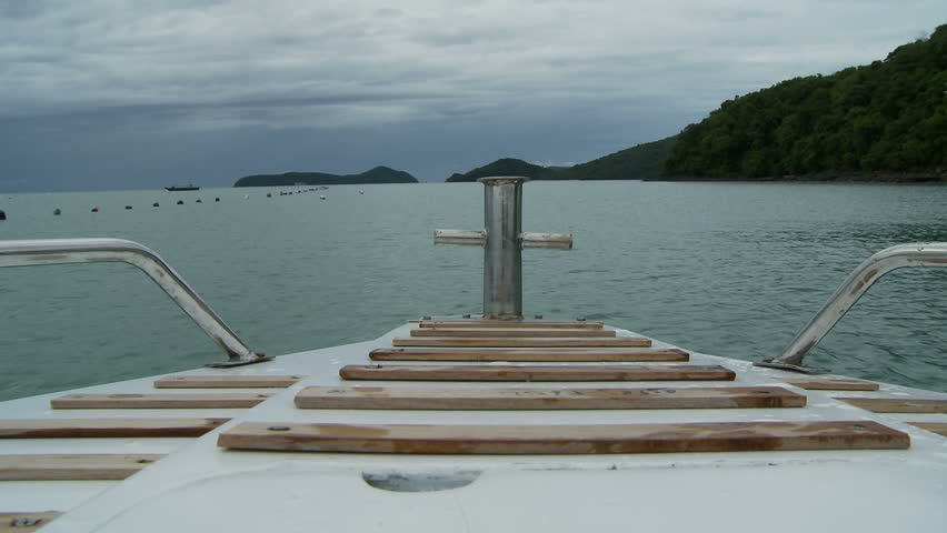 Overlooking bow of speedboat as it travels along Chalong Bay
