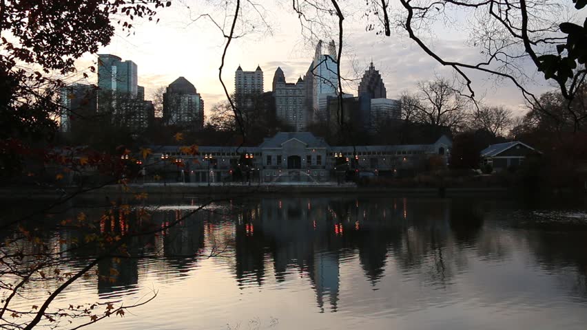 View of Lake Clara Meer, Piedmont Park Aquatic Center and Midtown Atlanta in sunny autumn day, USA