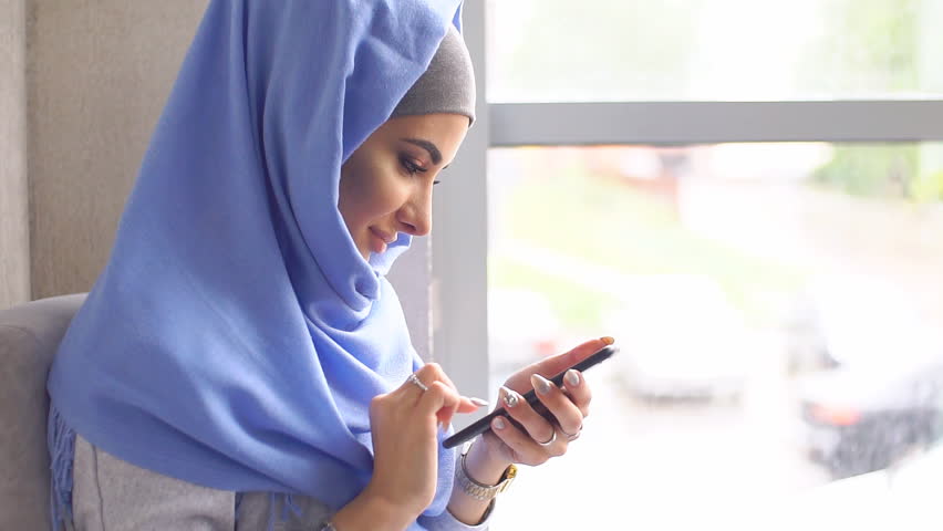 muslim girl holding modern mobile phone Stock Footage Video (100% Royalty-free) 28326427 | Shutterstock