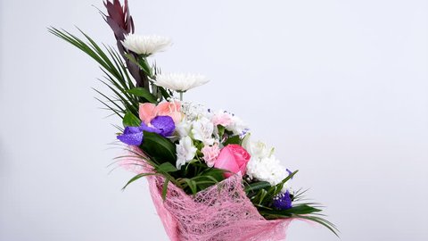 Flowers, bouquet, rotation on white background, floral composition consists of Leucadendron, Chrysanthemum anastasis, Amaryllis pink, Orchid vanda, Alstroemeria,