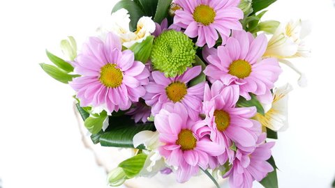 close-up, view from above, Flowers, bouquet, rotation, floral composition consists of Chrysanthemum Chamomile. Flower shop
