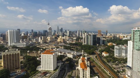 Time lapse: Kuala Lumpur city beautiful view during the day overlooking the city skyline with busy traffic. Motion Timelapse Zoom In.