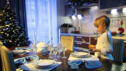 Stock Video Footage The little girl to lay the table