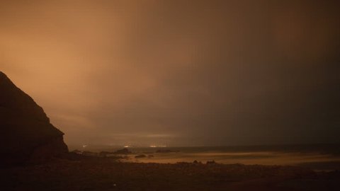 stormy nighttime timelapse of the stunning and dramatic coastline at duckpool beach on the cornwall coast, england