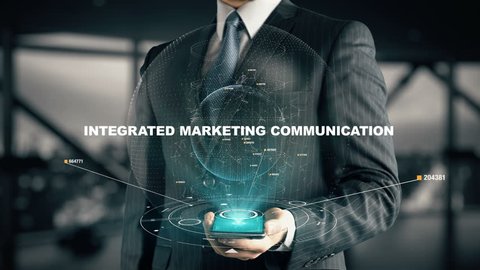 Businessman with Integrated Marketing Communication hologram concept