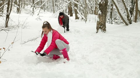 Young Couple Enjoying in Snow and Winter