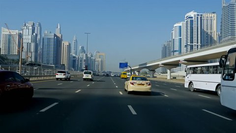 DUBAI, UNITED ARAB EMIRATES - May 2, 2017: Dubai Traffic, Car Traffic, Metro Station on Sheikh Zayed road in Dubai Skyscrapers downtown. Travel tourism business in United Arab Emirates