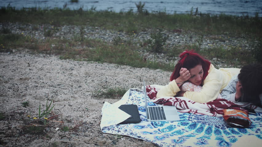 4k Family Having Picnic Next to the Lake