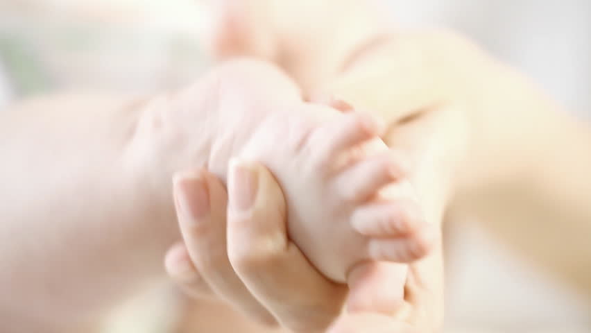 Baby feet on the light background