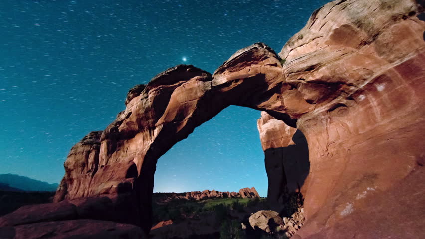 dawn breaking over rock arches Royalty-Free Stock Footage #28355722
