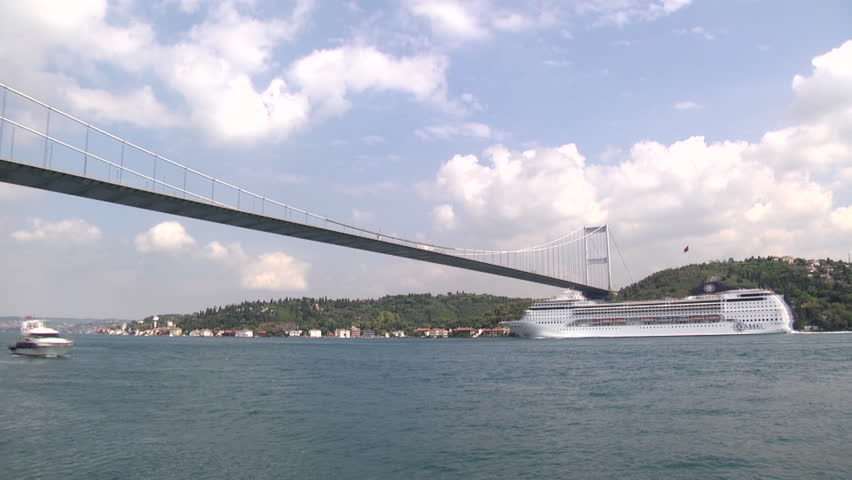 Time lapse in Istanbul. Big cruise ship is passing Bosporus Bridge