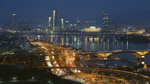 Aerial view of Seoul downtown cityscape and Seongsan bridge over Han River in twilight. Seoul, South Korea. Arkistovideo