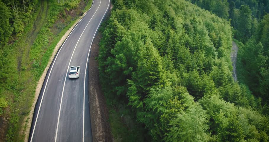 Aerial view of car driving through the forest on country road, Yedigoller, Turkey, 2017  Royalty-Free Stock Footage #28365199