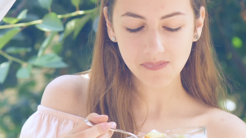 Young woman eating yogurt. Healthy summer diet.  | Shutterstock HD Video #28366696