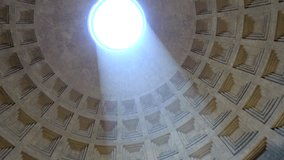 Rome Italy inside Pantheon looking up towards center of sphere hole in roof turning camera around and showing sunlight falling into temple to gods of ancient Rome now Roman Catholic church building 4k - Powered by Shutterstock - Get 15% off with code: PIKWIZARD15