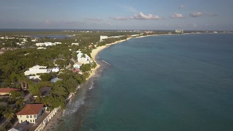 Flying over the tropical, Caribbean Seven Mile Beach on Grand Cayman