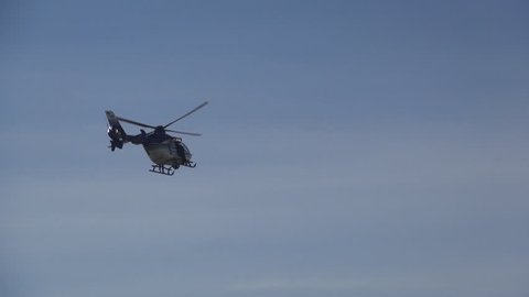 BUCHAREST, ROMANIA - SEPT 12, 2012: Air Show, Simulation of an Armed Attack Helicopter, Police Helicopter, Mission