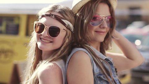 Close-up portrait of two hippy girl clothes. Young women in the style of a boho. slow motion