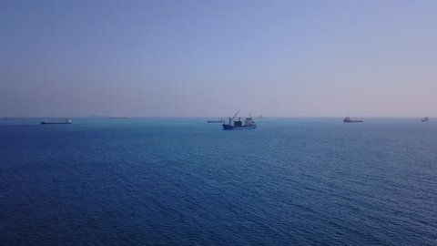Haifa, Israel - June 20 2017: MARE ZEN general cargo ship outside the port of Haifa aerial 4k view