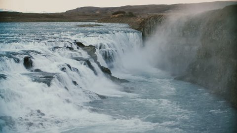 Beautiful landscape of the mountains and water. View of the amazing Gullfoss waterfall in Iceland.