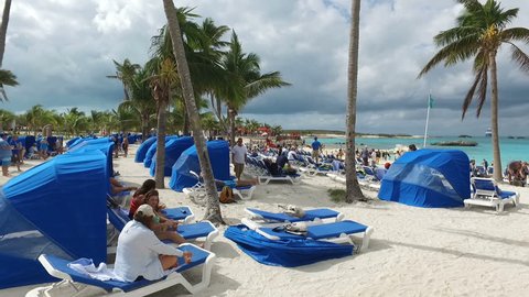 Tourists enjoy on deckchairs and under the awning,Bahamas,23rd of November 2016. 