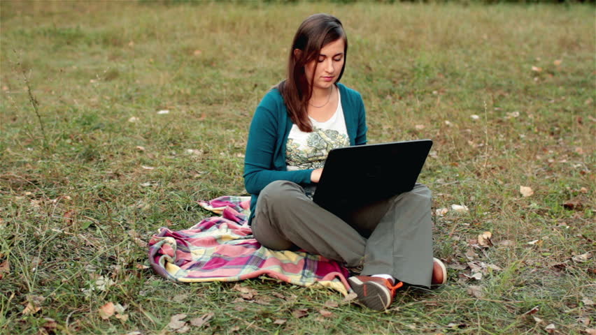girl working at a laptop