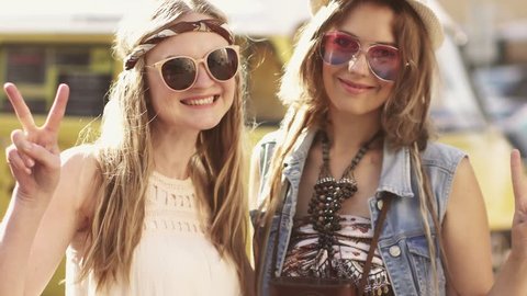 Close-up portrait of two hippy girl clothes. Young women in the style of a boho